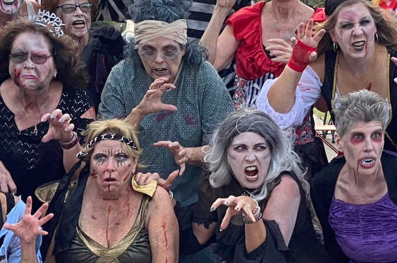 Pat and friends wearing colorful theatrical makeup