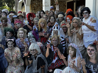 Large group wearing colorful theatrical character makeup